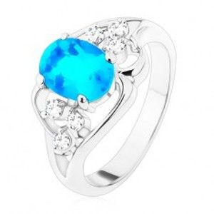 Prsten stříbrné barvy, velký modrý oválný zirkon, asymetrické linie R48.29